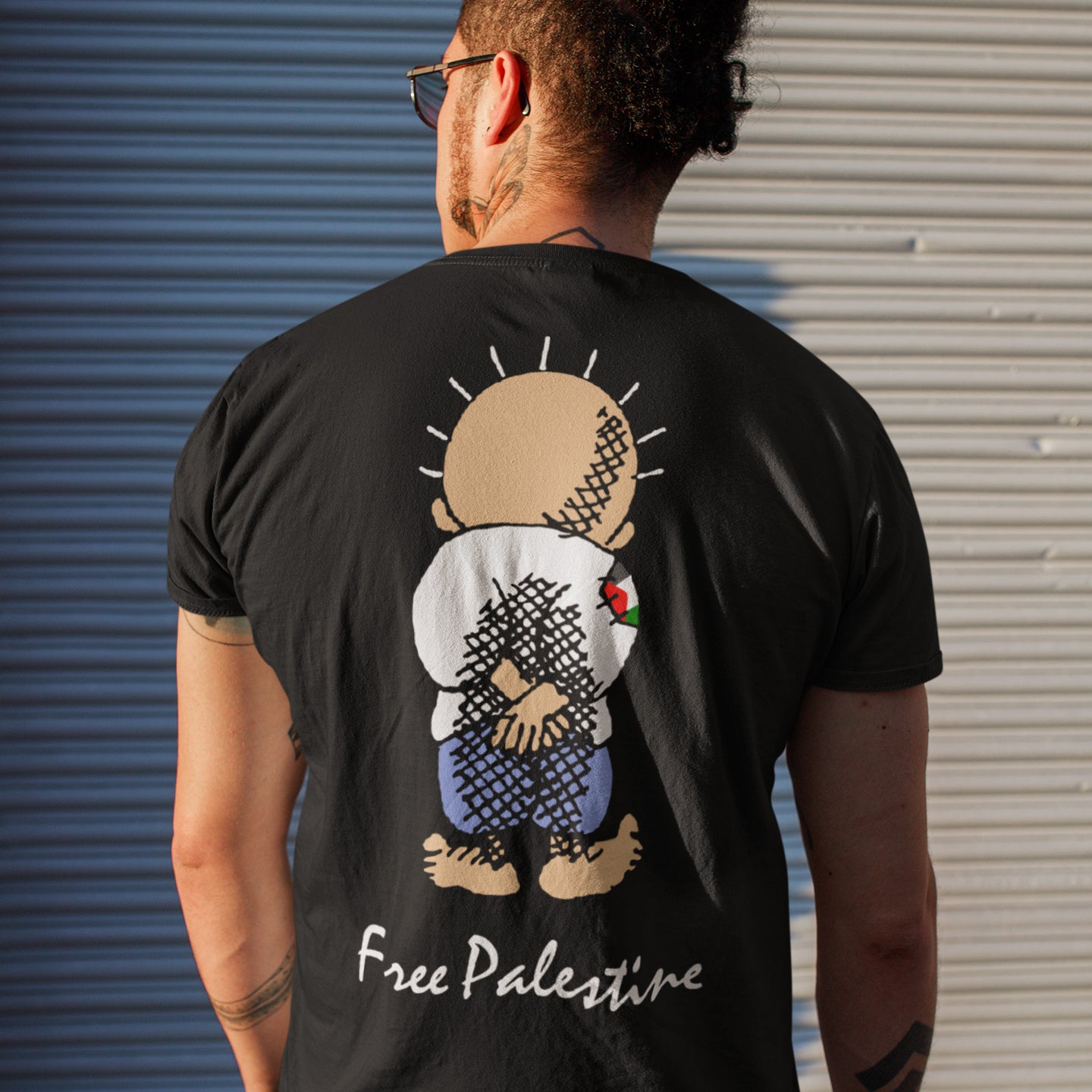 man wearing black free palestine handala t-shirt